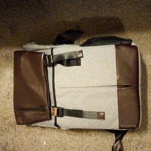 Mens neewer backpack large 18 long  one strap in back broken and spot on back